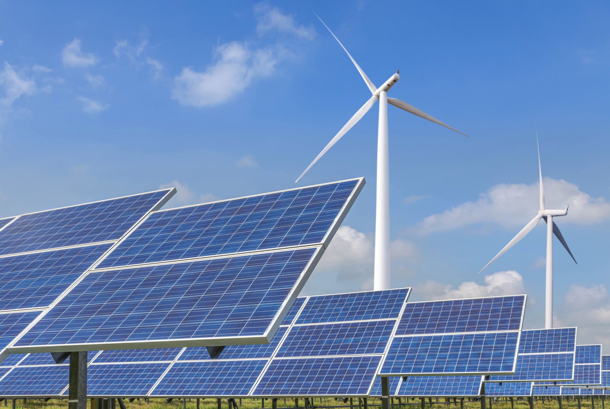 Solar panels and wind turbine in the British countryside 