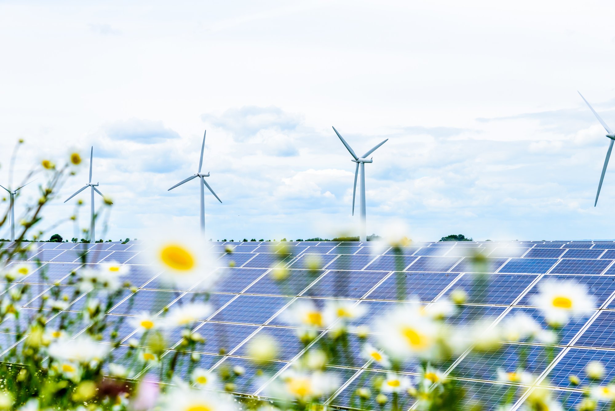 Solar panels and wind turbines in the British countryside