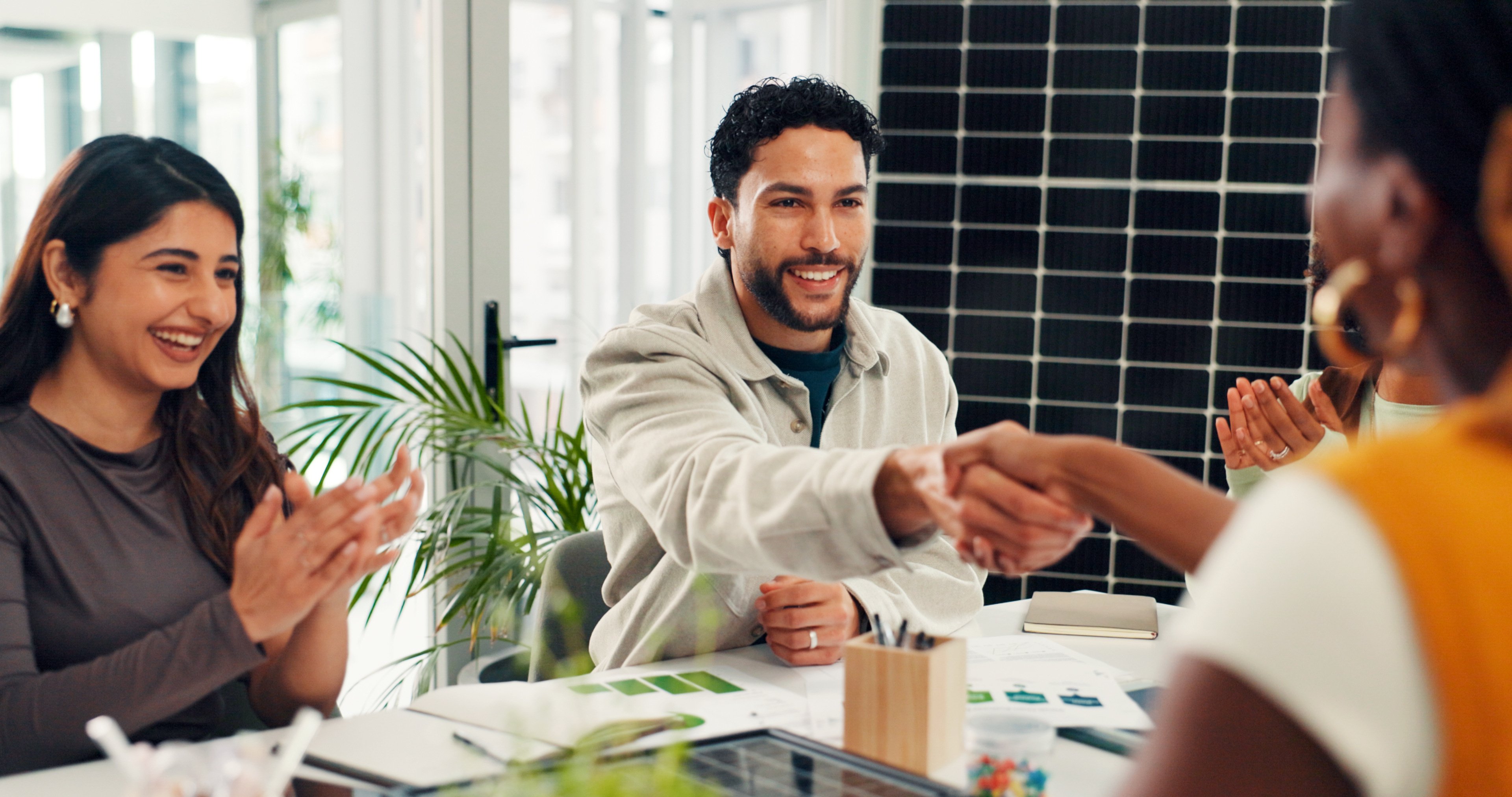 Businessmen shake hands on an energy contract.