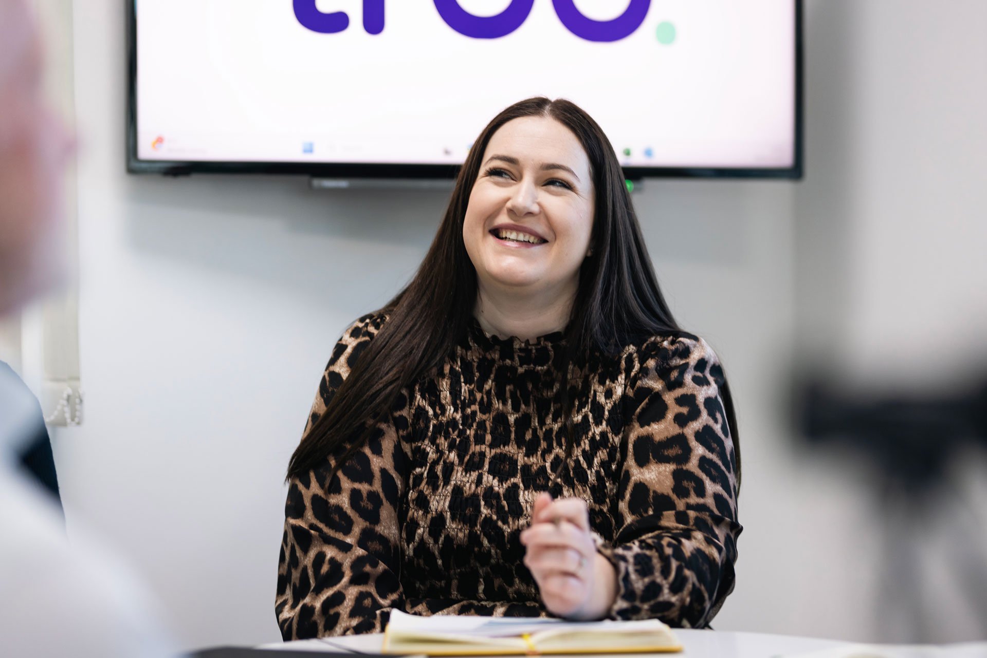Woman smiling during meeting