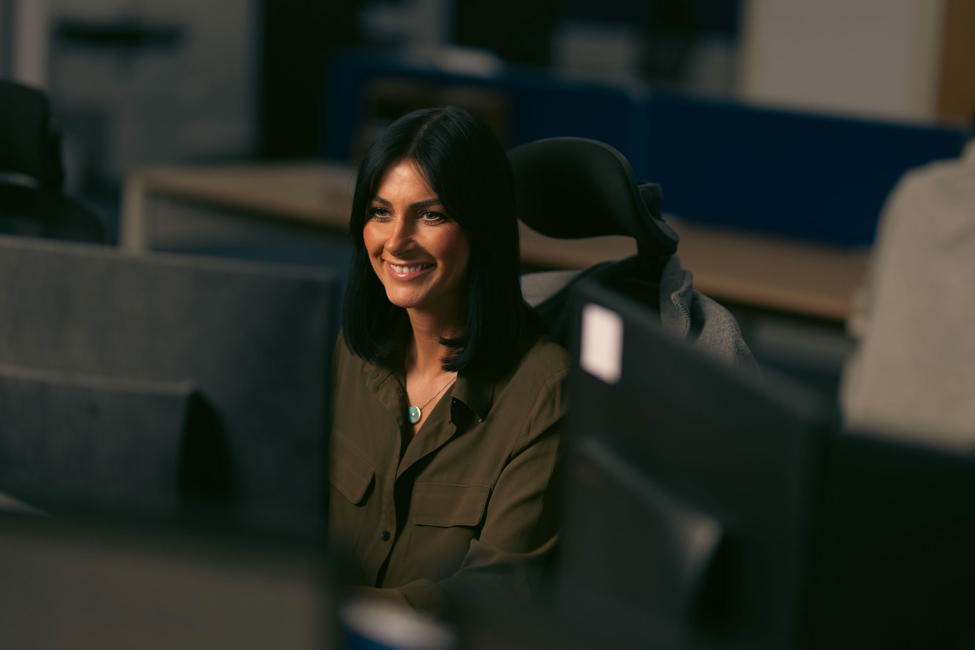 Woman smiling at her desk