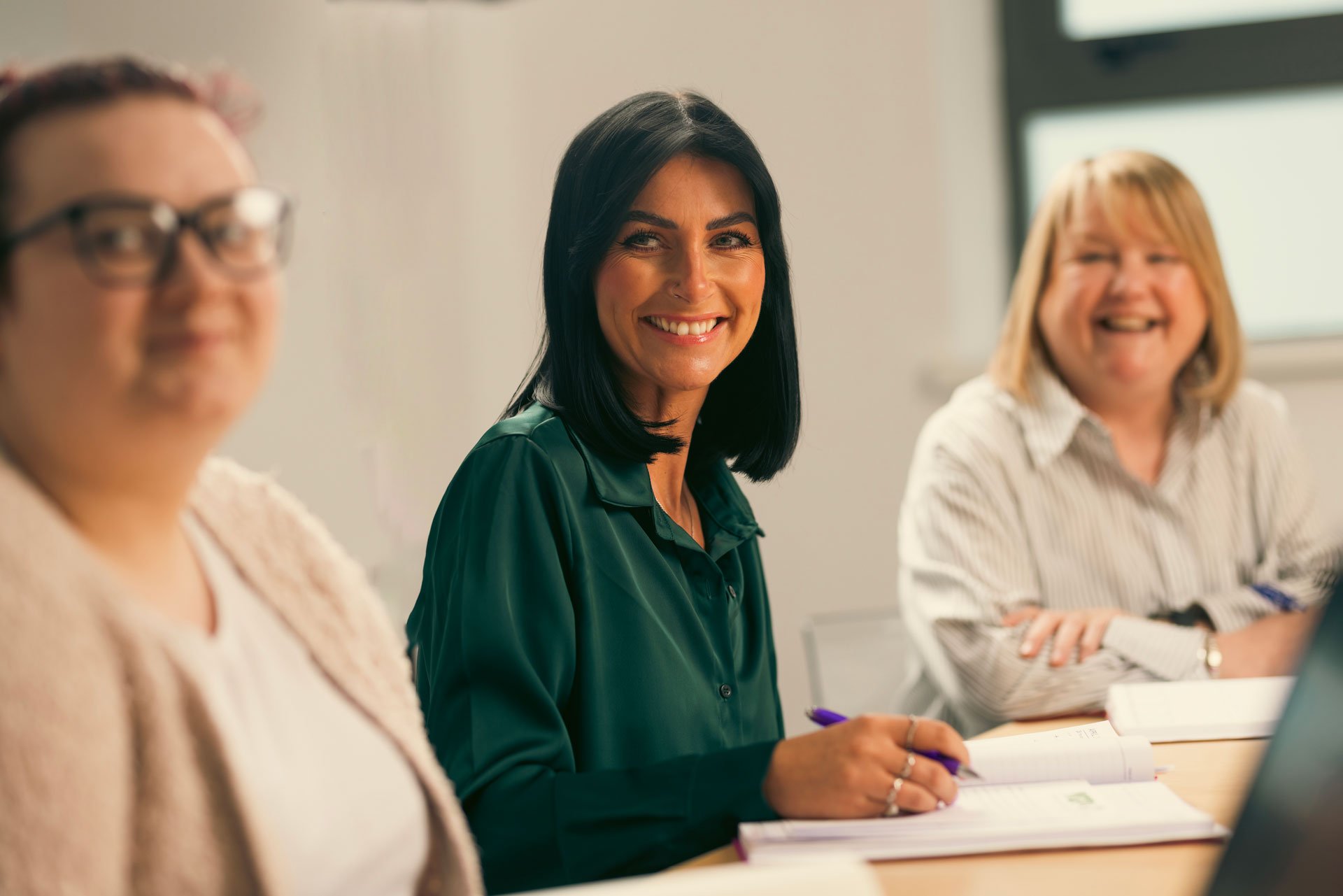 Woman smiling during meeting