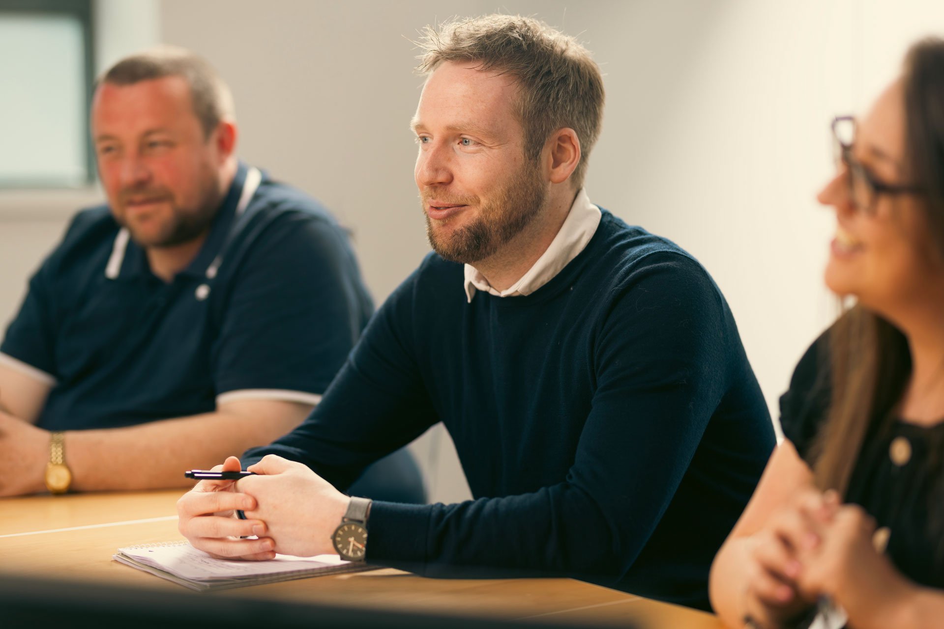 Three Troo Team members smiling whilst chatting