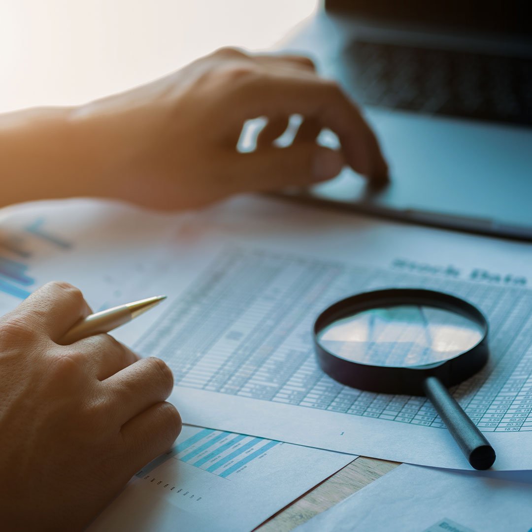 Person looking through the details of contracts and plans