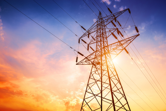 Electricity pylon with sunset behind