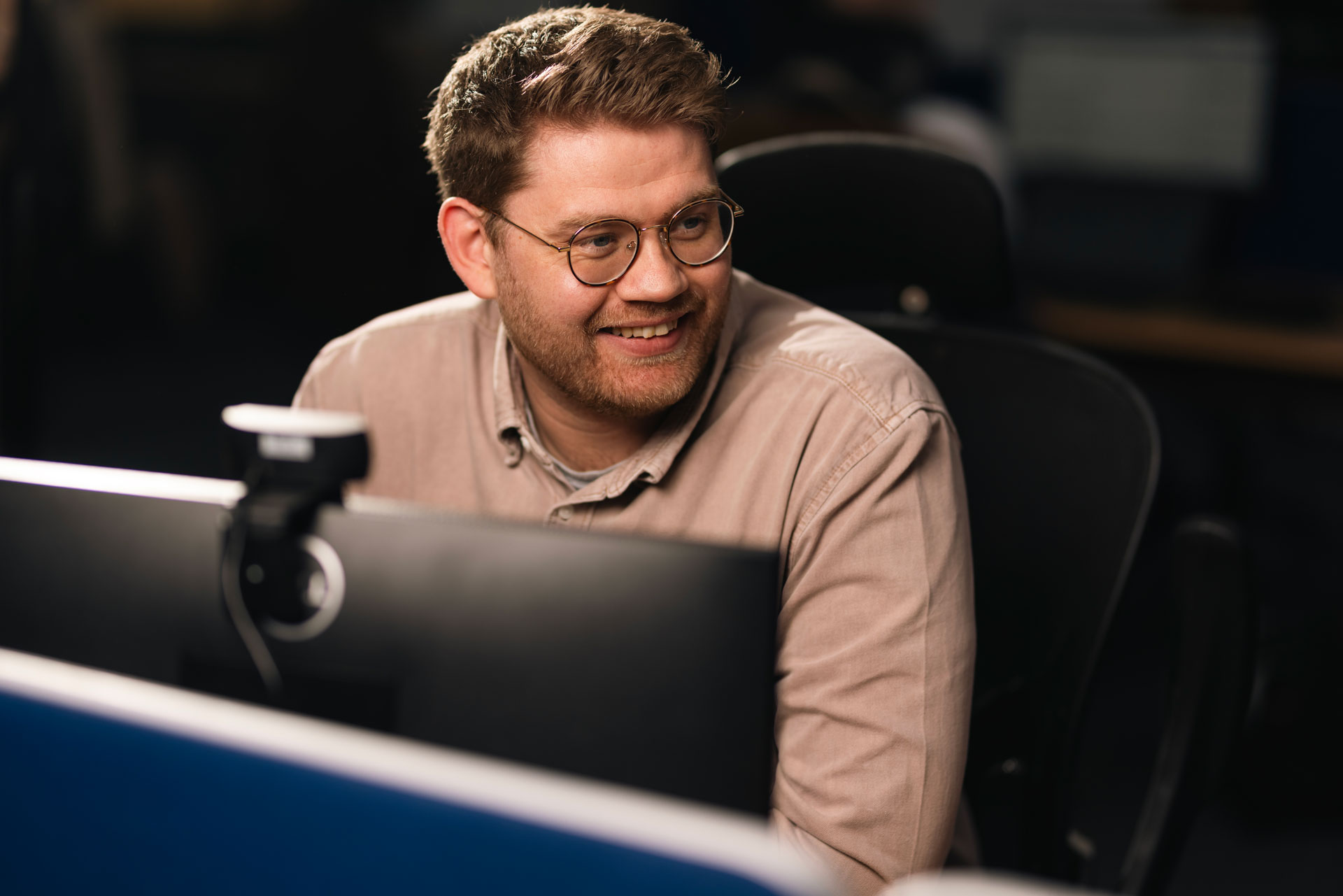 Man smiling at work