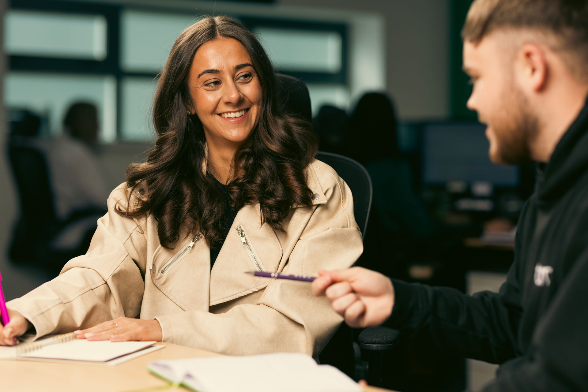 Woman smiling at her colleague